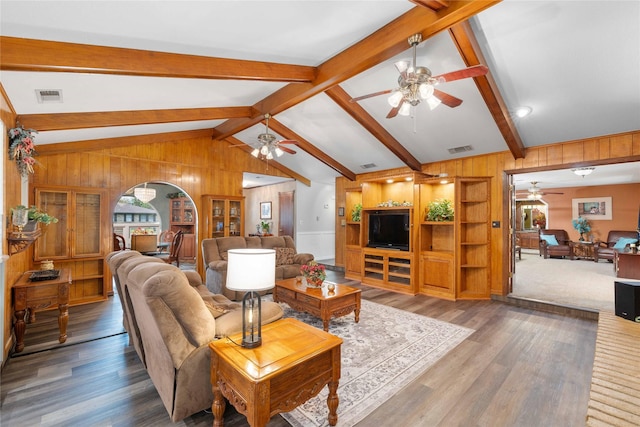 2514 Good Shepherd Dr, Brownwood, TX 76801 - living room featuring ceiling fan, wooden walls, and wood finished floors