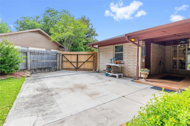 2514 Good Shepherd Dr, Brownwood, TX 76801 - view of patio featuring a gate and a ceiling fan