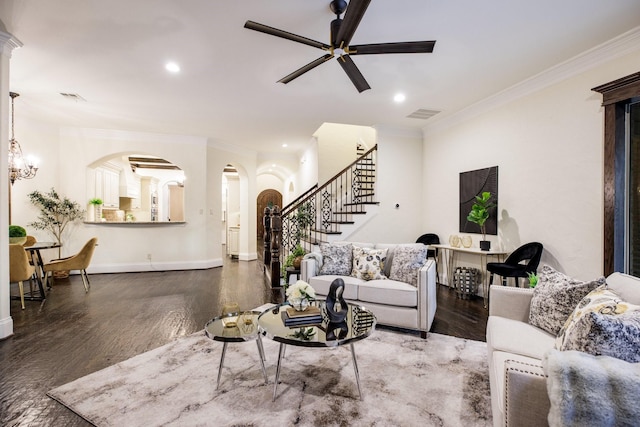 6131 Arboretum Dr, Frisco, TX 75034 - living room featuring stairs, crown molding, wood finished floors, arched walkways, and a ceiling fan
