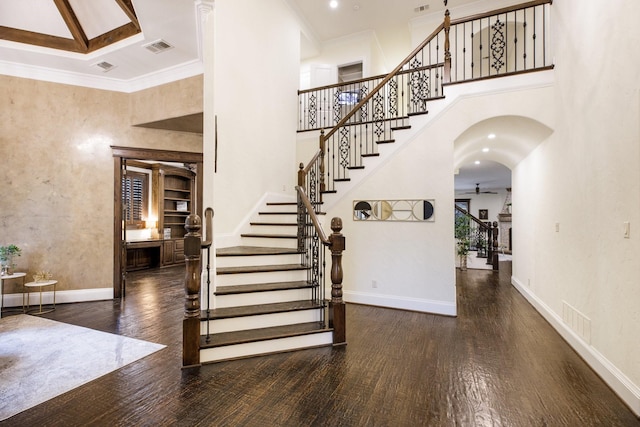 6131 Arboretum Dr, Frisco, TX 75034 - stairs featuring wood finished floors, a high ceiling, baseboards, ceiling fan, and arched walkways