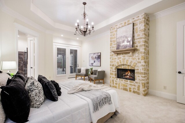 6131 Arboretum Dr, Frisco, TX 75034 - carpeted bedroom with a chandelier, a fireplace, access to exterior, crown molding, and recessed lighting