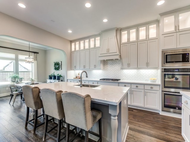 3051 Kennington Dr, Prosper, TX 75078 - kitchen featuring a sink, stainless steel appliances, tasteful backsplash, a breakfast bar, and recessed lighting