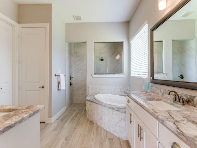 3051 Kennington Dr, Prosper, TX 75078 - full bathroom featuring vanity, a bath, a marble finish shower, and wood finished floors
