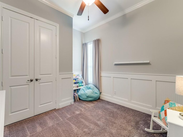 3051 Kennington Dr, Prosper, TX 75078 - rec room with ornamental molding, a ceiling fan, carpet flooring, and a wainscoted wall