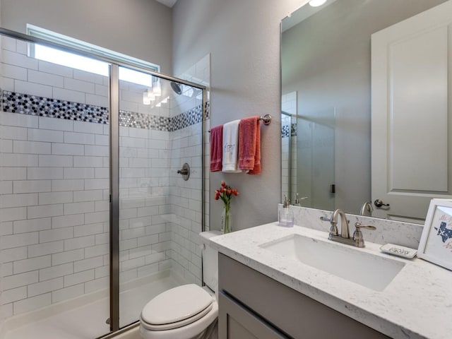 3051 Kennington Dr, Prosper, TX 75078 - bathroom with a shower stall, toilet, and vanity