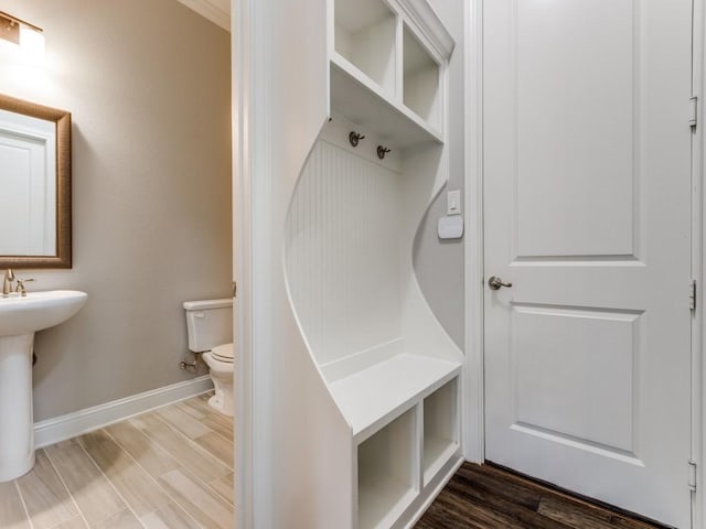 3051 Kennington Dr, Prosper, TX 75078 - mudroom featuring baseboards, wood finished floors, and a sink
