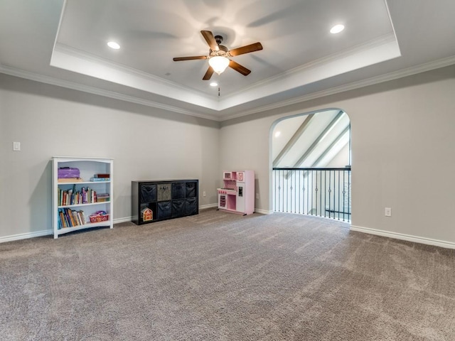 3051 Kennington Dr, Prosper, TX 75078 - rec room featuring a raised ceiling, a ceiling fan, ornamental molding, carpet, and baseboards