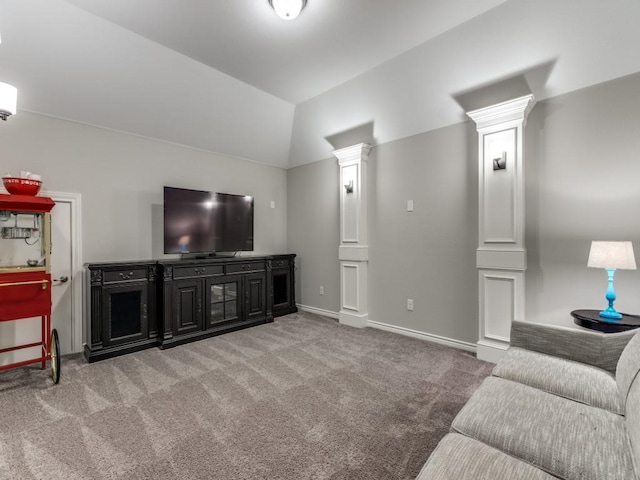 3051 Kennington Dr, Prosper, TX 75078 - carpeted living area featuring decorative columns, vaulted ceiling, and baseboards