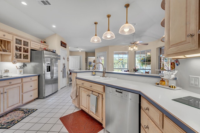 9712 Elm Creek Way, Fort Worth, TX 76140 - kitchen with stainless steel appliances, a sink, light brown cabinets, light countertops, and glass insert cabinets