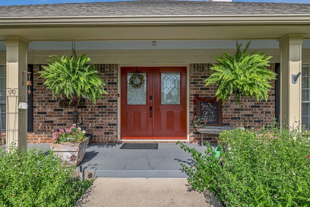 9712 Elm Creek Way, Fort Worth, TX 76140 - property entrance featuring brick siding, a shingled roof, and a porch