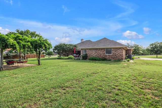9712 Elm Creek Way, Fort Worth, TX 76140 - view of side of home with brick siding and a patio
