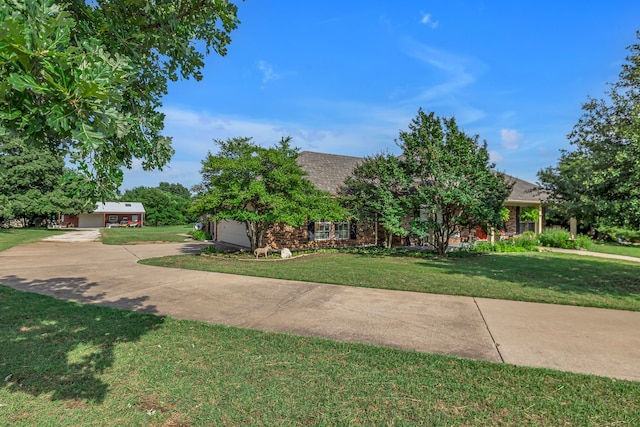 9712 Elm Creek Way, Fort Worth, TX 76140 - obstructed view of property featuring a front lawn, driveway, an attached garage, brick siding, and a shingled roof