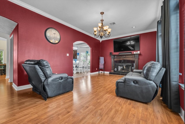 403 Gibraltar Ln, Lorena, TX 76655 - living room with arched walkways, ornamental molding, light wood-type flooring, a chandelier, and baseboards