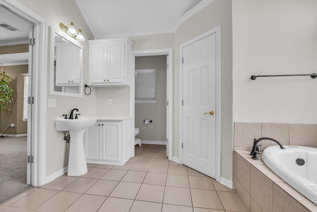 403 Gibraltar Ln, Lorena, TX 76655 - full bathroom with crown molding, a garden tub, toilet, baseboards, and tile patterned floors