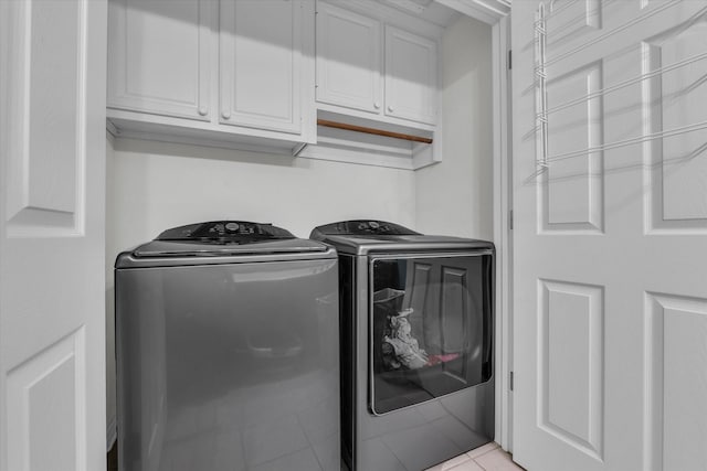 403 Gibraltar Ln, Lorena, TX 76655 - washroom with cabinet space, washing machine and dryer, and light tile patterned floors