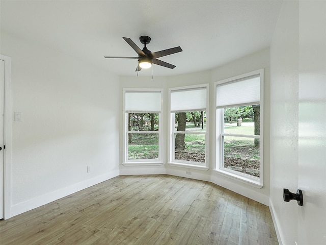 351 Oak Creek Dr, New Hope, TX 75071 - unfurnished room with wood finished floors, baseboards, and a ceiling fan