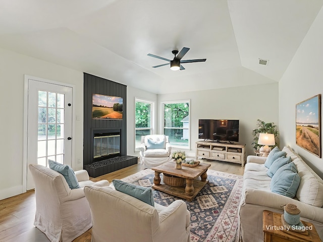 351 Oak Creek Dr, New Hope, TX 75071 - living room with wood finished floors, healthy amount of natural light, a ceiling fan, a fireplace, and vaulted ceiling