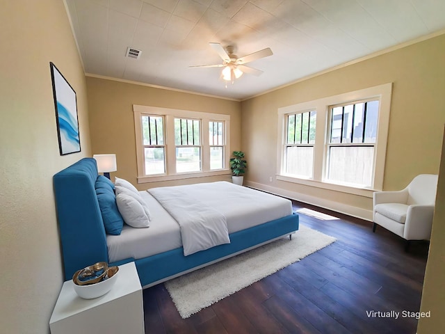 2107 Homan Ave, Waco, TX 76707 - bedroom with ornamental molding, dark wood-style flooring, and a ceiling fan