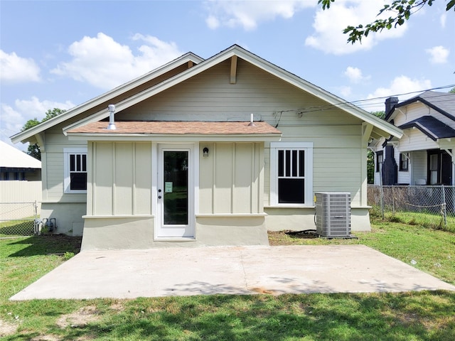 2107 Homan Ave, Waco, TX 76707 - rear view of property featuring board and batten siding, a patio, and a shingled roof