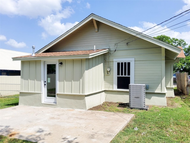 2107 Homan Ave, Waco, TX 76707 - rear view of property with a patio, board and batten siding, and roof with shingles