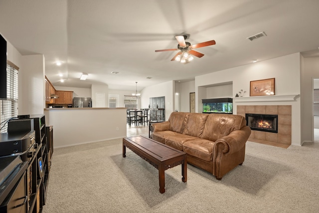 515 Angela Ln, Euless, TX 76039 - living room featuring light colored carpet, a ceiling fan, a fireplace, a chandelier, and baseboards