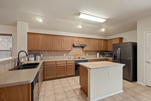515 Angela Ln, Euless, TX 76039 - kitchen with black appliances, a sink, light tile patterned floors, backsplash, and a peninsula