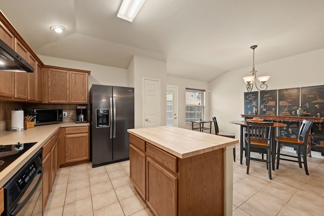 515 Angela Ln, Euless, TX 76039 - kitchen featuring stainless steel fridge, oven, light tile patterned floors, lofted ceiling, and decorative backsplash