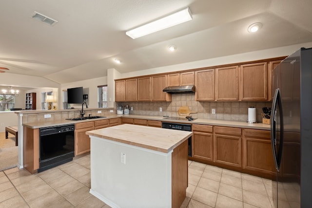 515 Angela Ln, Euless, TX 76039 - kitchen featuring black appliances, a sink, under cabinet range hood, a peninsula, and butcher block countertops