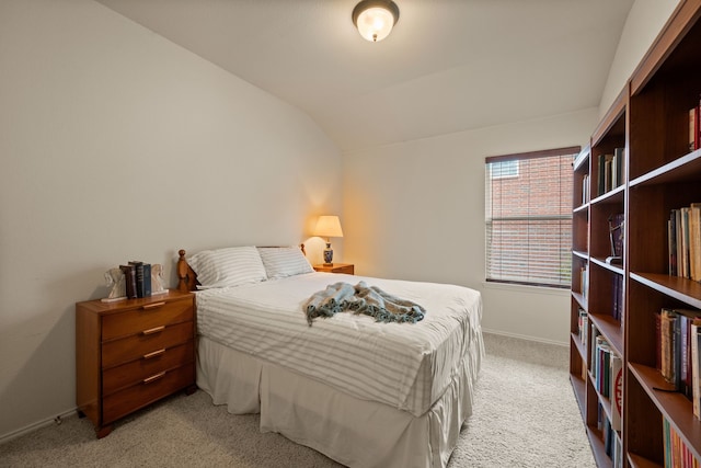515 Angela Ln, Euless, TX 76039 - bedroom with light colored carpet, lofted ceiling, and baseboards