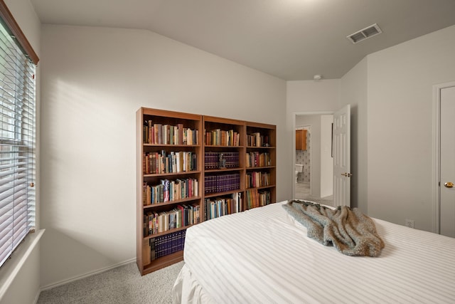 515 Angela Ln, Euless, TX 76039 - carpeted bedroom featuring vaulted ceiling and baseboards