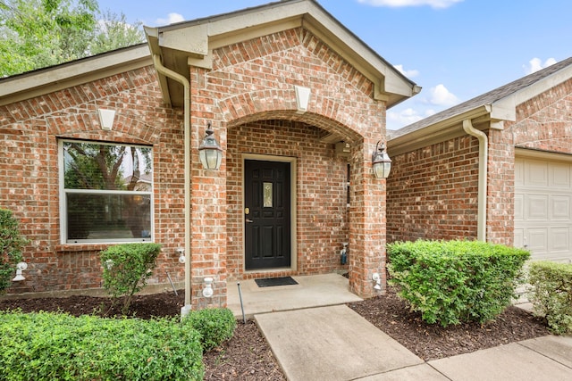 515 Angela Ln, Euless, TX 76039 - doorway to property with a garage and brick siding
