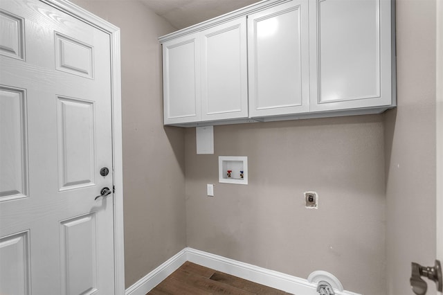 1904 Alston St, Arlington, TX 76013 - laundry room featuring hookup for a washing machine, baseboards, electric dryer hookup, dark wood-type flooring, and cabinet space