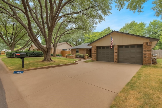 1904 Alston St, Arlington, TX 76013 - view of front facade with brick siding, a garage, and concrete driveway