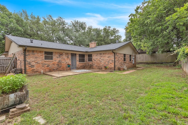 1904 Alston St, Arlington, TX 76013 - back of house featuring a patio area, brick siding, and a chimney