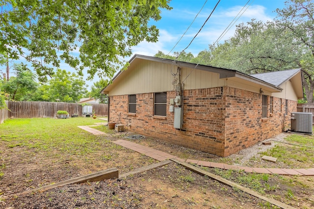 1904 Alston St, Arlington, TX 76013 - view of side of home with brick siding and central AC unit