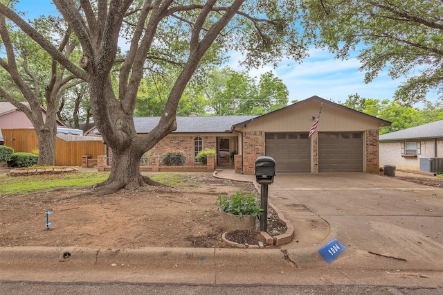 1904 Alston St, Arlington, TX 76013 - view of front facade with brick siding, an attached garage, concrete driveway, and cooling unit