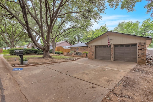 1904 Alston St, Arlington, TX 76013 - view of front facade with brick siding, driveway, and a garage