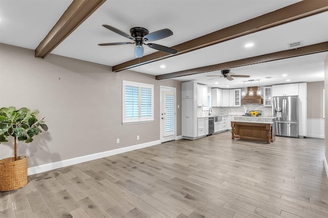 1904 Alston St, Arlington, TX 76013 - living room with a ceiling fan, recessed lighting, baseboards, beam ceiling, and light wood-style flooring
