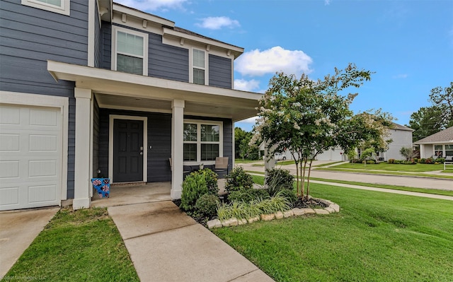 129 Clear Creek Ln, Terrell, TX 75160 - property entrance with a lawn, a porch, and a garage