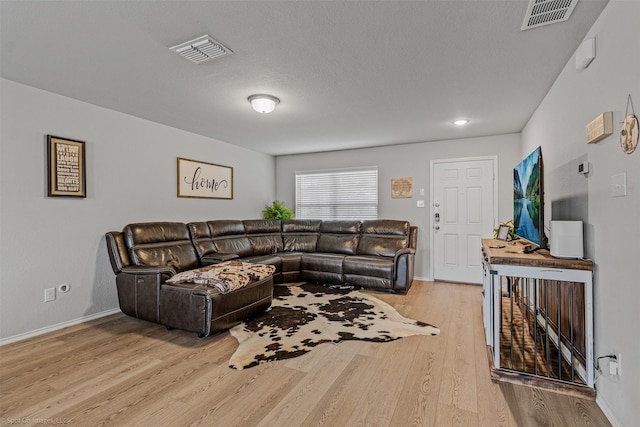 129 Clear Creek Ln, Terrell, TX 75160 - living room featuring light wood-style floors and baseboards