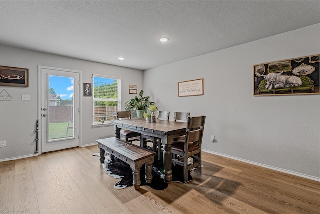 129 Clear Creek Ln, Terrell, TX 75160 - dining area featuring light wood finished floors, baseboards, recessed lighting, and a textured ceiling
