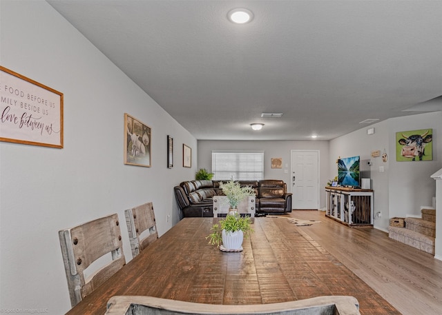 129 Clear Creek Ln, Terrell, TX 75160 - dining area featuring wood finished floors and stairs