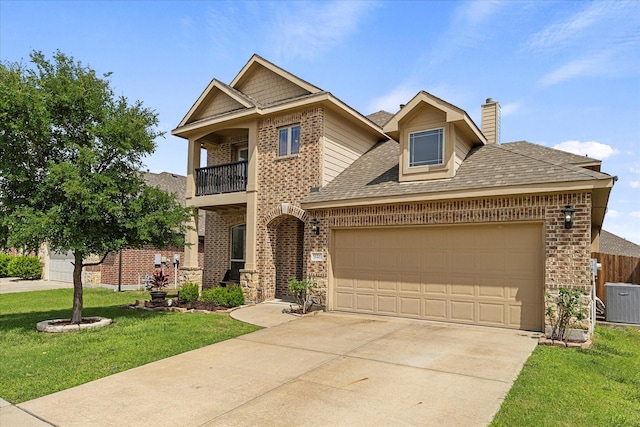 946 Mangrove Dr, Fate, TX 75087 - view of front of home featuring a balcony, brick siding, an attached garage, concrete driveway, and a chimney