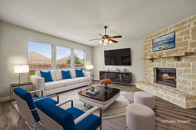 946 Mangrove Dr, Fate, TX 75087 - living room with wood finished floors, ceiling fan, a fireplace, and baseboards