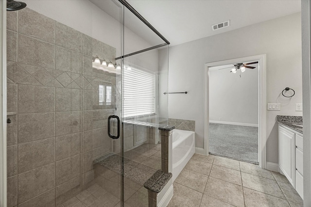 946 Mangrove Dr, Fate, TX 75087 - bathroom featuring vanity, a bath, a shower stall, tile patterned floors, and a ceiling fan