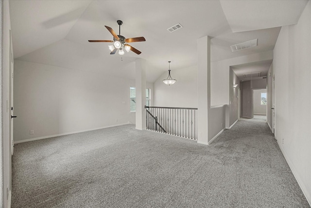 946 Mangrove Dr, Fate, TX 75087 - carpeted empty room with attic access, lofted ceiling, ceiling fan, and baseboards