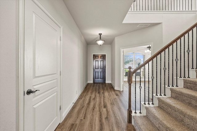 946 Mangrove Dr, Fate, TX 75087 - entryway with wood finished floors, stairway, baseboards, and ceiling fan