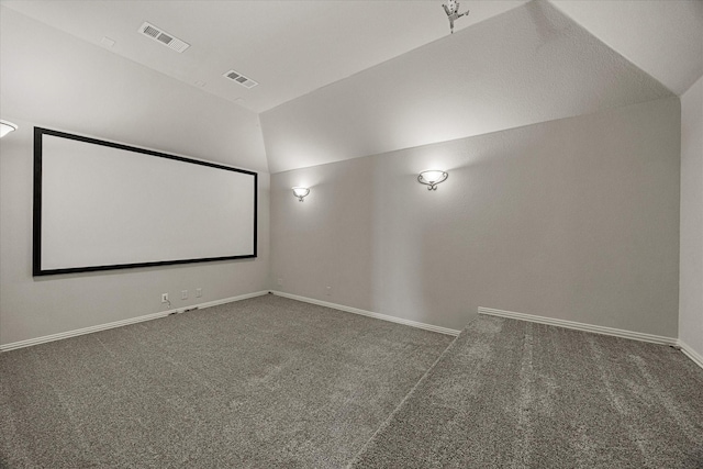 946 Mangrove Dr, Fate, TX 75087 - home theater featuring lofted ceiling, carpet floors, and baseboards