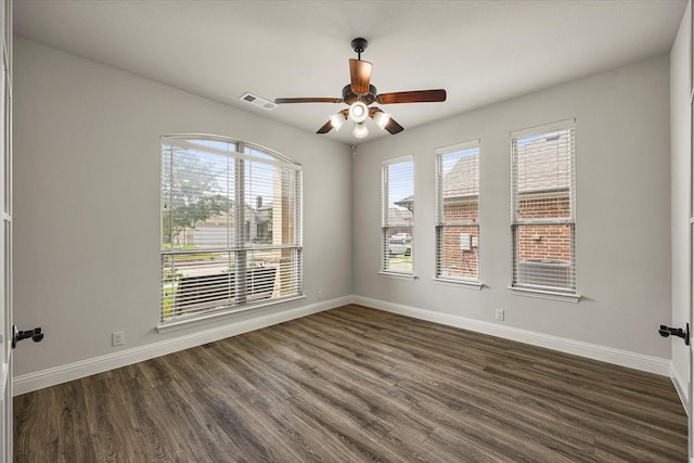946 Mangrove Dr, Fate, TX 75087 - unfurnished room featuring dark wood-style flooring, baseboards, and ceiling fan