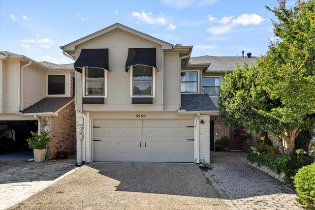 5556 Canada Ct, Rockwall, TX 75032 - multi unit property with asphalt driveway, brick siding, a garage, and roof with shingles